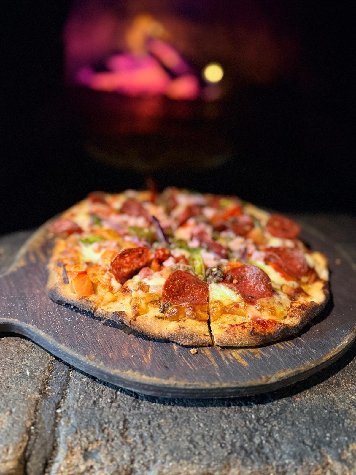 Woodfired pizza served at Morpeth Woodfire Pizza & Indian Delicacies